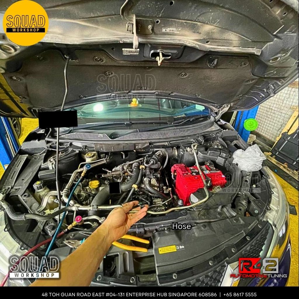 Nissan Qashqai J11 undergoing air-con compressor, expansion valve, and coolant hose replacement at Squad Workshop Singapore